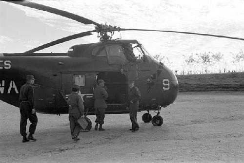 Soldiers near a helicopter