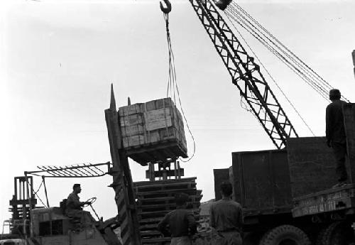 Crane lifting boxes