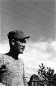 Man standing beneath powerlines