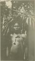 Chocó man standing beneath foliage