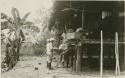 Expedition members standing by raised Chocó house