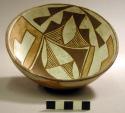 Pottery bowl--diameter 5.875" height 2.5"; geometric design--interior, dark and