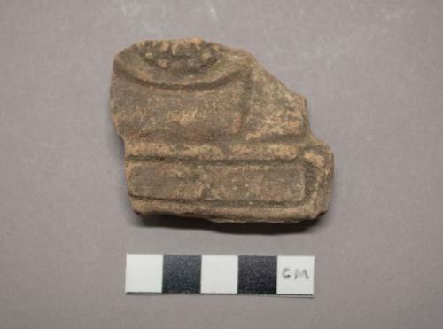 Pottery throne fragment