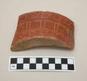 Incised red potsherd