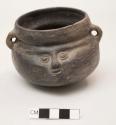 Small bowl with 2 handles, constricted neck, molded face, incised eyes