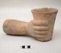 Ceramic effigy vessel keros in form of hand holding keros
