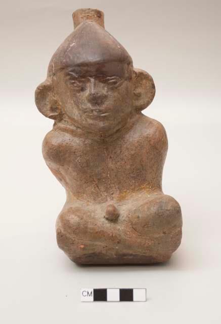 Effigy vessel, single spout, captive with hands tied behind back, rope around neck, naked but for conical hat; extensive restoration