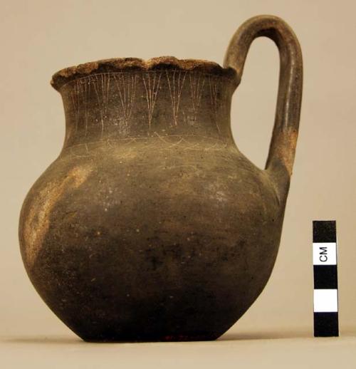 Poor Bucchero pottery jug with one handle