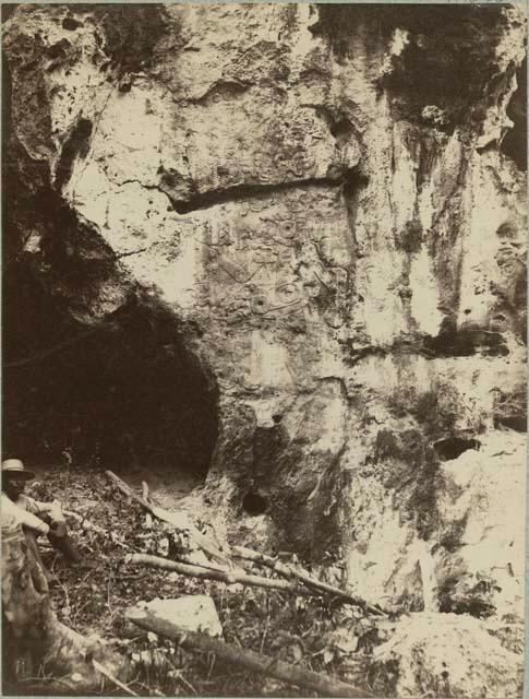 Sculptured figure at entrance of cave