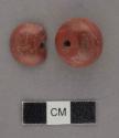 Globular red stone bead