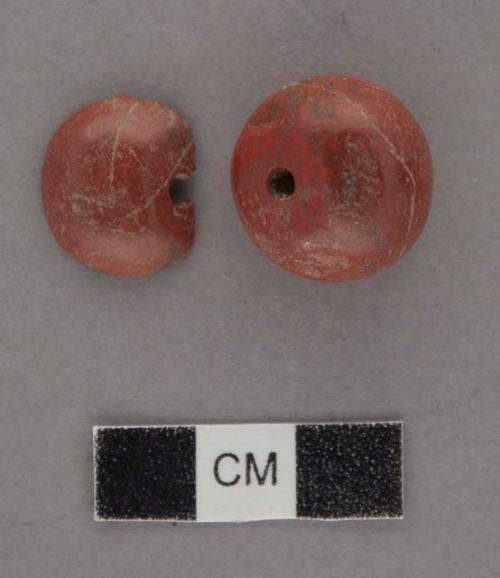 Globular red stone bead