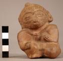 Pottery whistle - seated animal figure