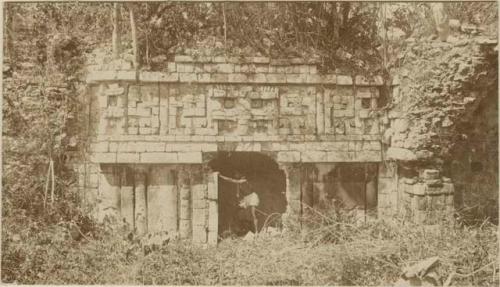 Man working in archway, right wing, edifice no. 1