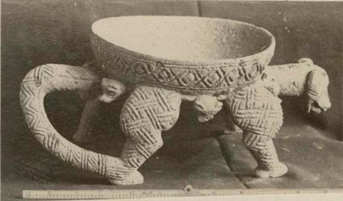 Pottery bowl with jaguar body as base