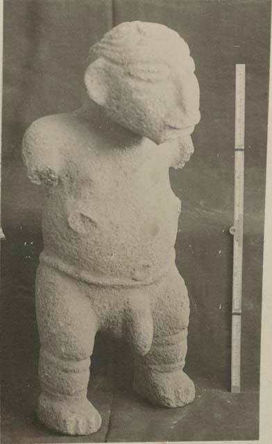 Carved stone male effigy