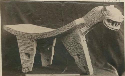 Carved stone effigy metate