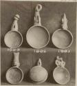 Pottery dishes with effigy handles