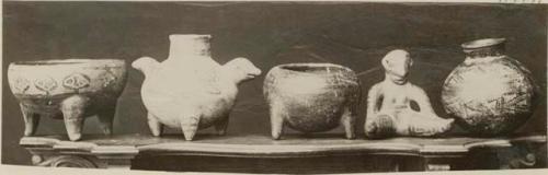 Pottery vessel and effigy figure