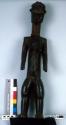 Standing female ancestor figure with scarification patterns on torso; "superb he