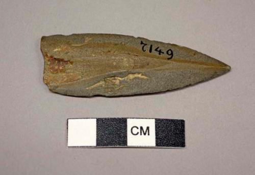 Stone arrowhead with edges ground