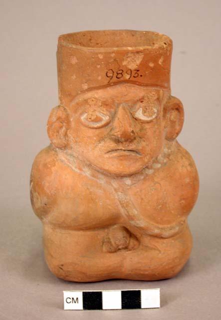 Ceramic vase, human effigy, molded face, ears and hands, kneeling