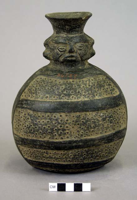 Ceramic jar, strap handle, human effigy face, engraved dots & linear bands