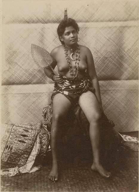 Samoan woman. posed, holding fan