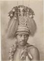 Samoan man wearing elaborate headdress, studio portrait