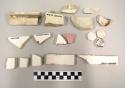Coarse marble and porcelain fragments, including mouldings and basin? rims. inc