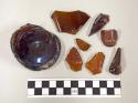 Brown bottle glass, including 1 intact base marked a 2, pressed designed on some
