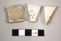 Miscellaneous white china sherds, one with embossed pattern