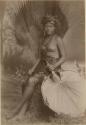 Samoan woman, posed, holding large fan