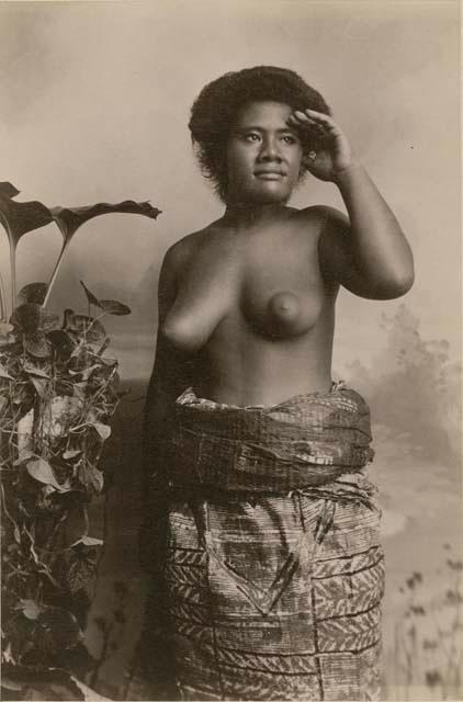 Samoan woman, posed studio portrait, looking into distance