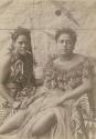 Two Samoan women in front of Tapa cloth