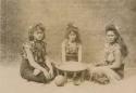 Three young Samoan women, apparently making kava