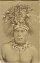 Samoan man wearing headdress, studio portrait