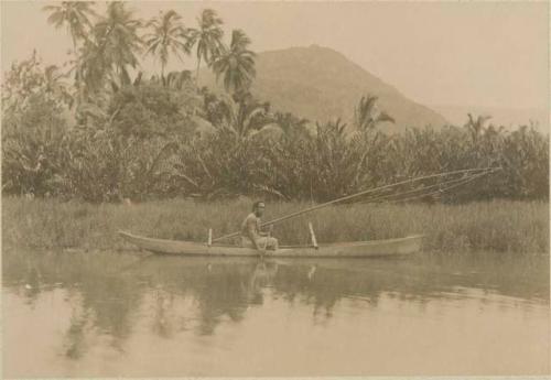 Man paddling a canoe