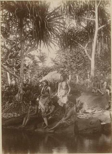 Group in the forest, posing by water