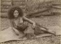 Samoan girl, posed, lounging on mat