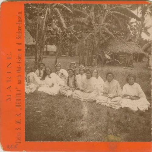 Group of women seated, wearing western style dresses