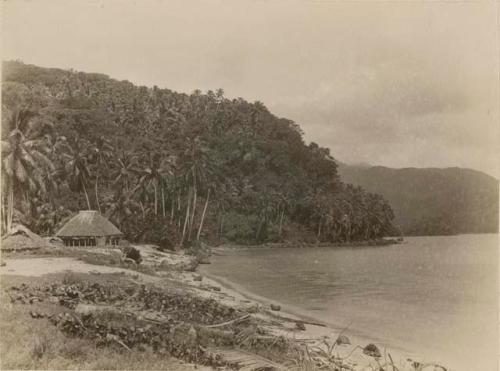 View of shoreline with two huts