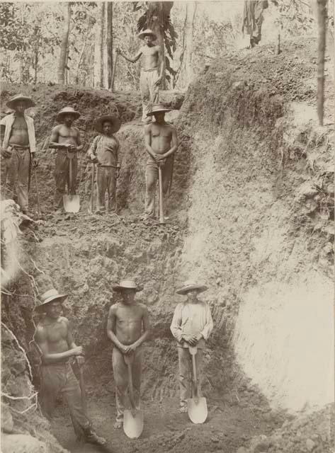 Workers posing at excavation site