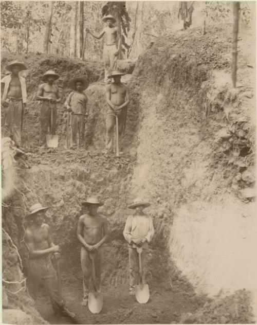 Workers posing at excavation site