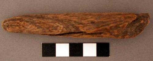 Wooden (ironwood) handle, probably for stone knife. l: 10.4 cm.