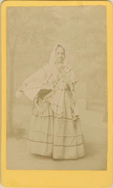 Portrait of Mexican woman holding wide shallow basket