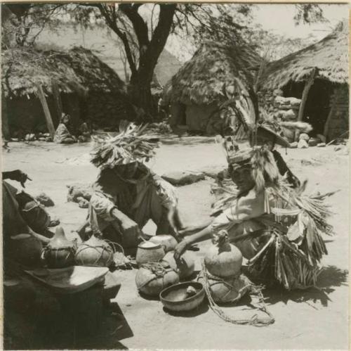 Leaders of Peyote ceremony mixing Peyote drink.