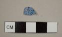 Refined white earthenware sherd with blue speckles