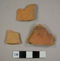 Coarse redware sherds, possibly tile fragments