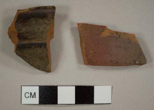 Redware sherds, including one rim sherd to a crock