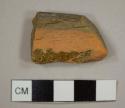 Lead glazed redware rim sherd, possibly from a bowl